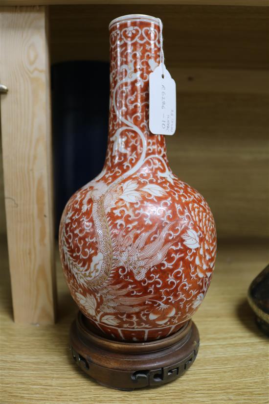 A late/early 19th century Chinese coral red phoenix vase height 29cm incl. carved stand